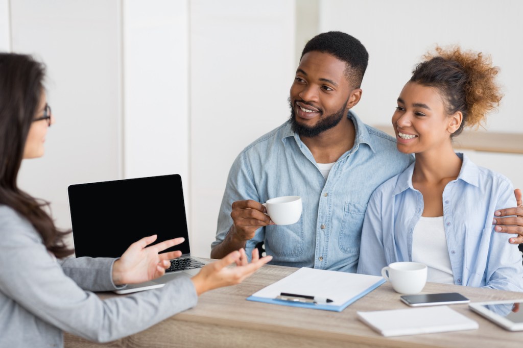 Afro Couple Attending Home Buying Consultation In Real Estate Agency